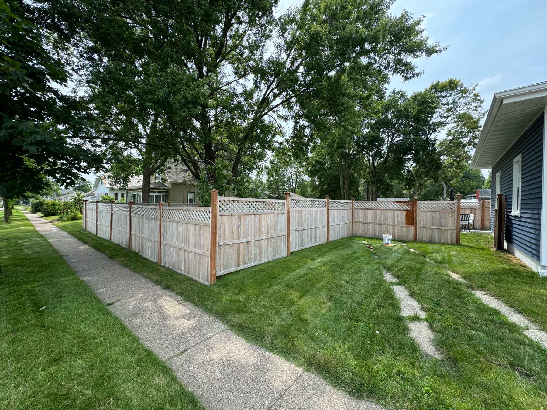 Fence Restoration 10 A Fence Partially Stained In A Yard