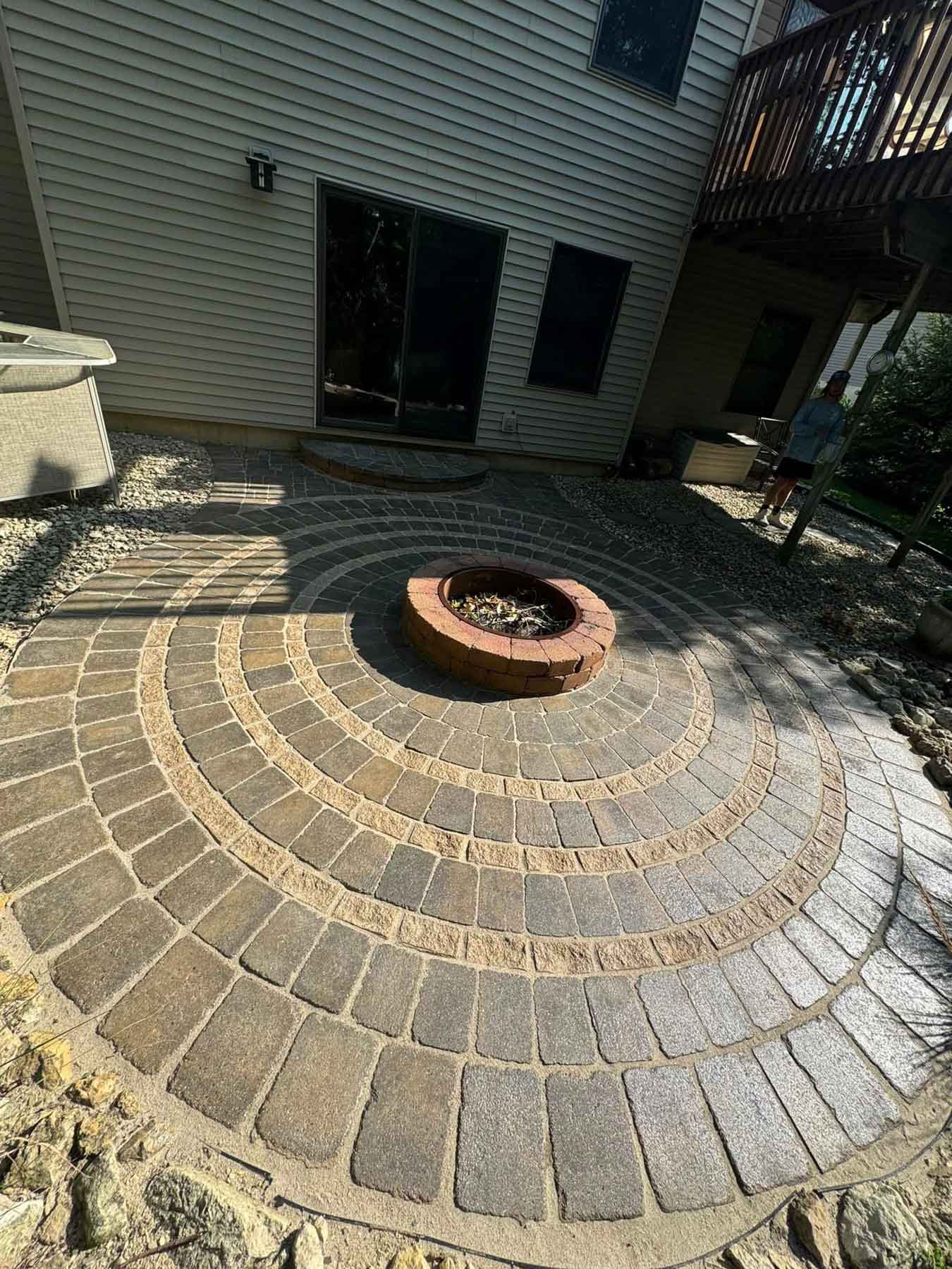 Paver Cleaning 35 Pavers Around A Fire Pit After Being Cleaned By Driftless Exteriors