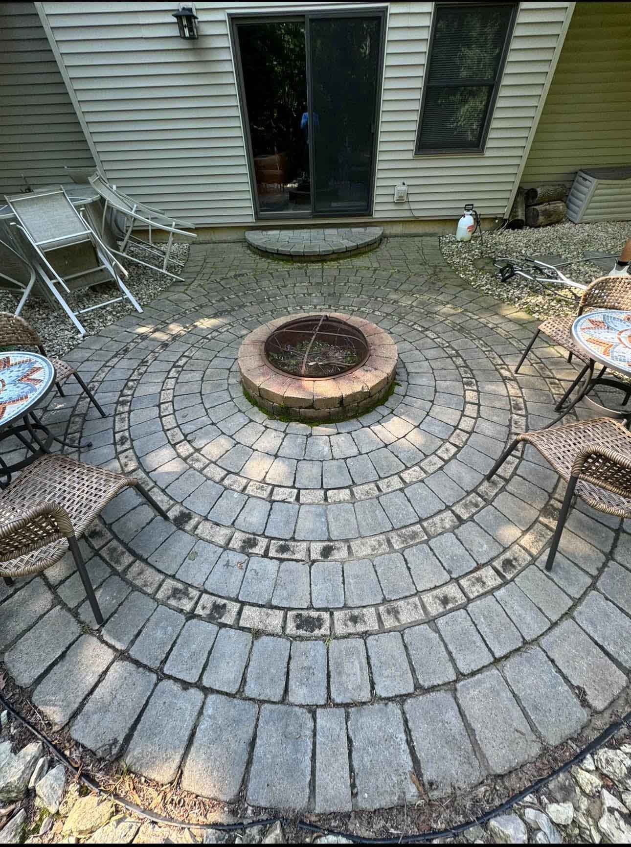 Paver Cleaning 34 Patio With Fire Pit Before Being Cleaned By Driftless Exteriors